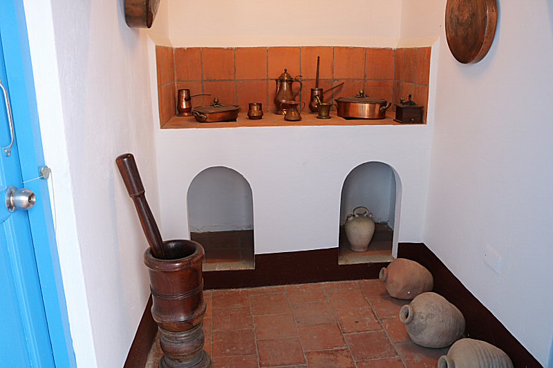 the kitchen with pots and containers made of copper