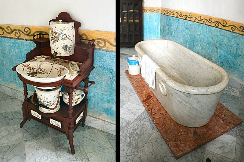 the marble bathtub and the flower textured porcelain washbasin with soap dishes