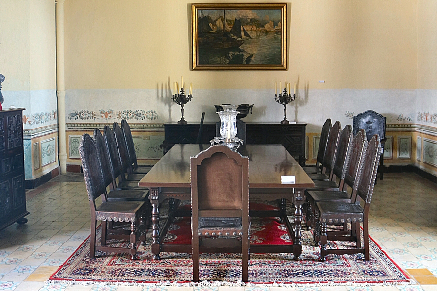 The dining room set, made of mahogany, leather and bronze. It was manufactured in the last decade of the 19th century for the Marquises of Duquesne.