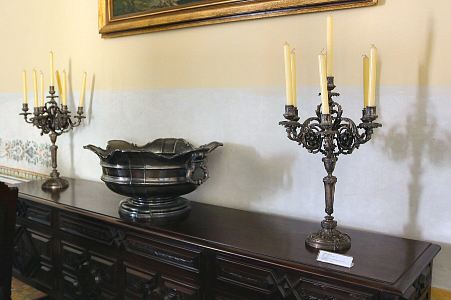 The punch bowl made of silver. It is from 1970s and made by Gorham in the US. The crystal candlesticks are from the 20th century.