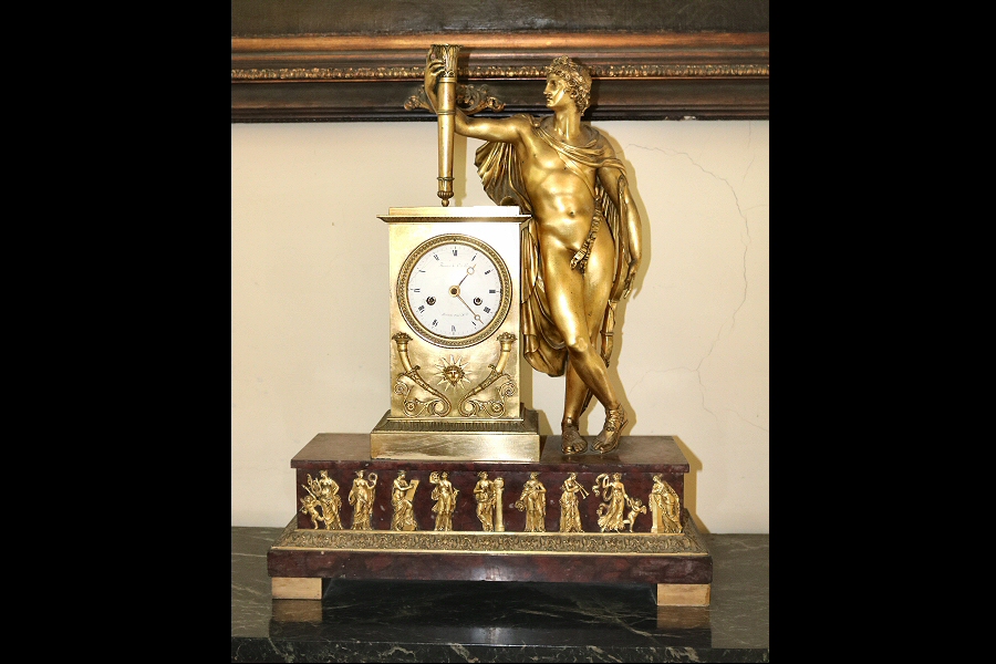 The bronze French table clock with Apollo from the 19th century. It is the work of the skillful clockmaker (horologist) Louis Moinet l'Aîné, but the bronze work belongs to Pierre Philippe Thomire.