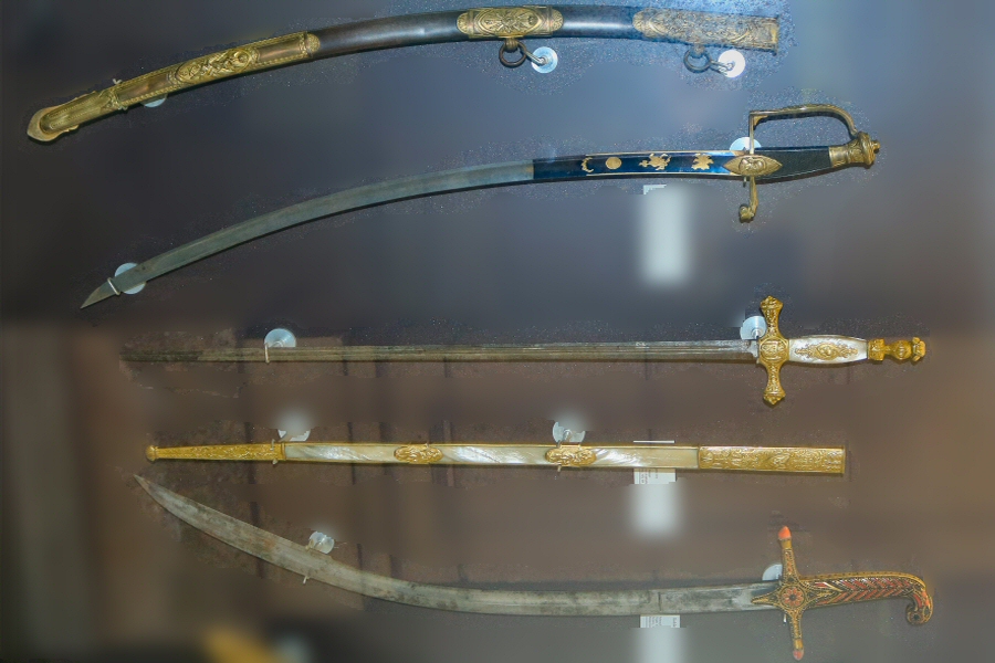 the sword of Marshal Lannes (above), close friend of Napoléon, and the Turkish-style steel, gilt bronze, and coral sabre of the King of Naples, Joachim Murat (below)
  